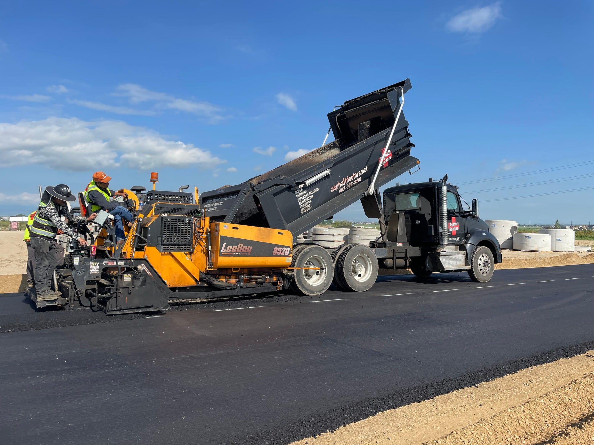 workers with asphalt truck