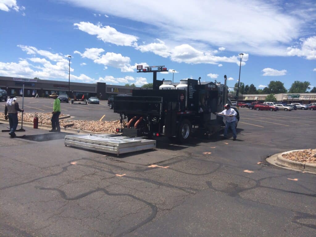 infrared asphalt repair in a parking lot of a business