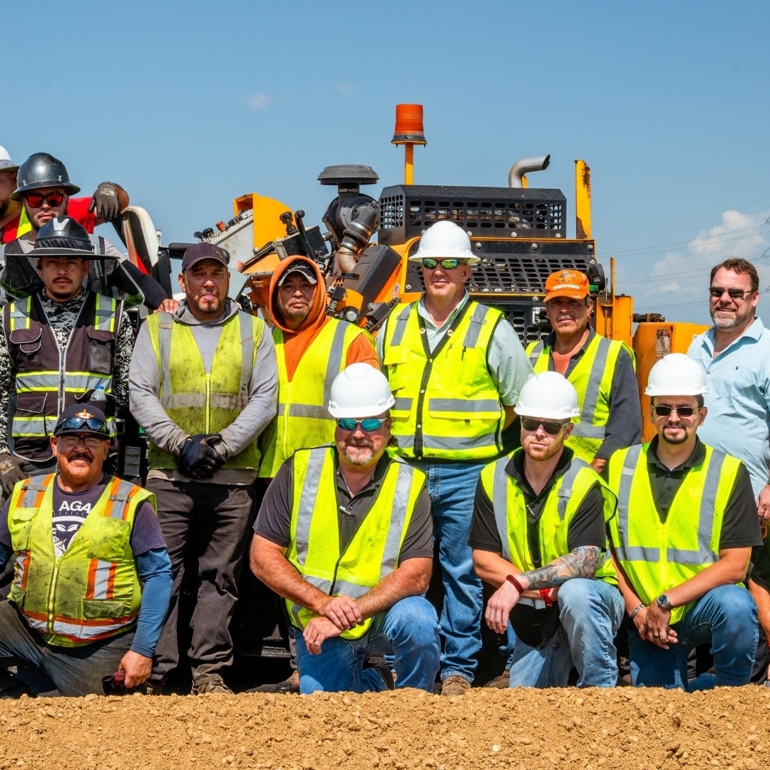 group of men working on an infrared asphalt patching job